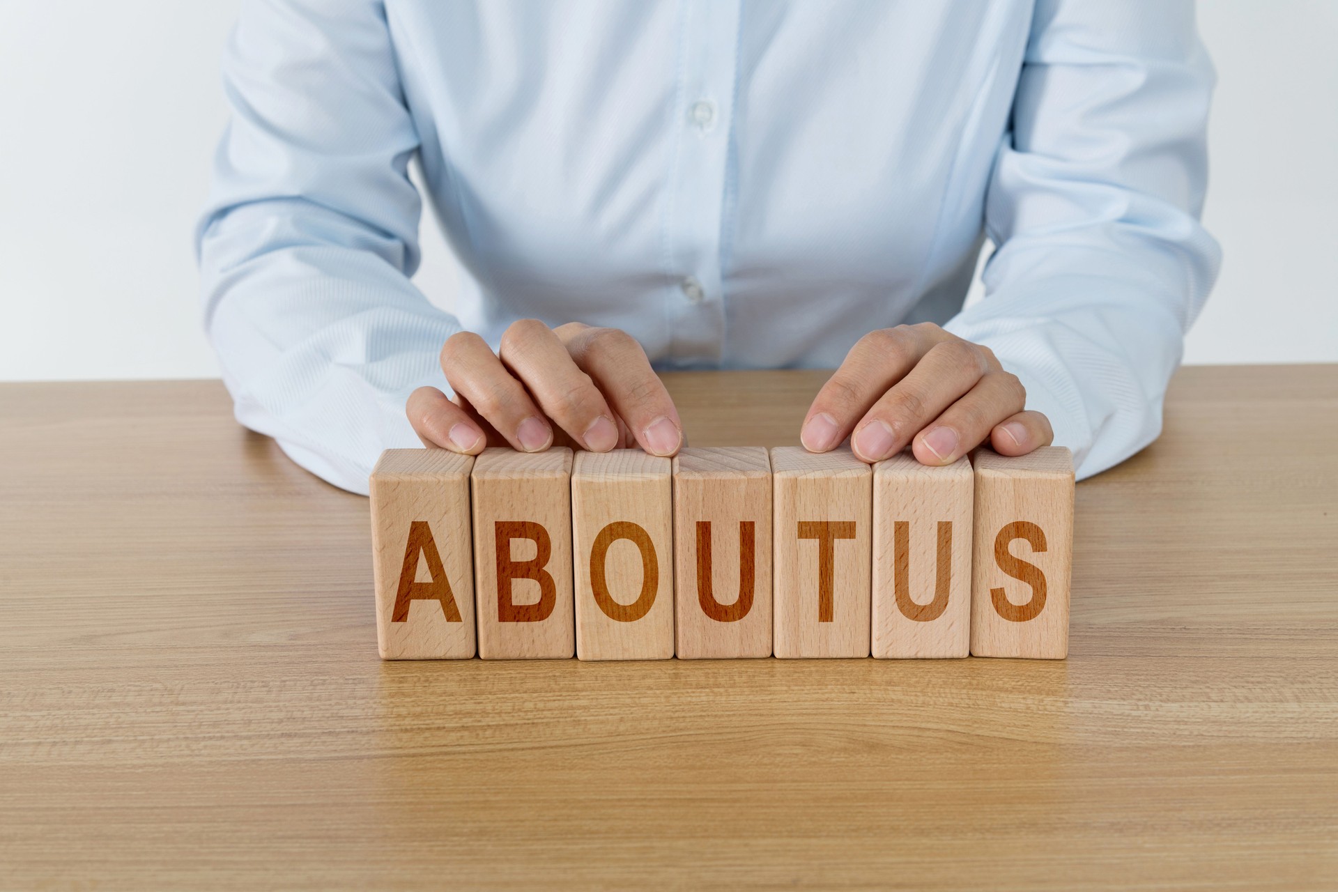 About us word on a red wooden block